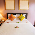 Hotel bed in a boutique hotel using parking management solutions.