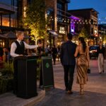 Guests arriving in a walkable restaurant and entertainment district with professional valet service supporting multiple dining and nightlife venues.