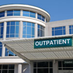 Outpatient Sign over a Hospital Outpatient Services Entrance.