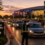 Parking attendants direct heavy vehicle traffic as guests arrive for a large event, illustrating efficient event parking management during peak arrival periods.